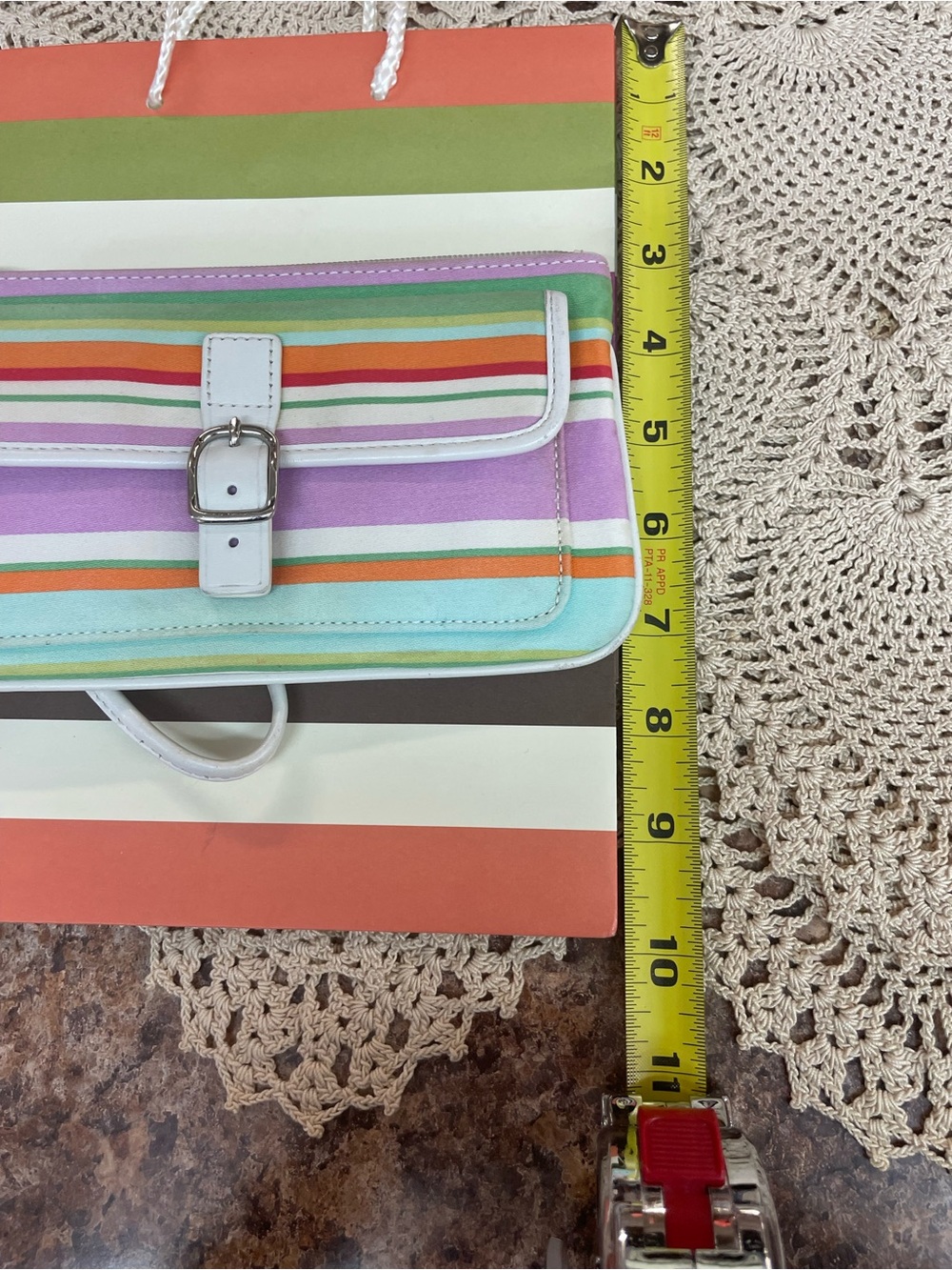Coach Hampton striped wristlet with her Coach gift bag. - Picture 7 of 8